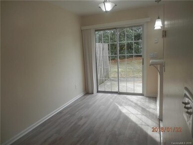 Laminate Wood Dining Area opens to Private Patio