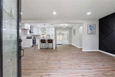 Kitchen featuring stainless steel range with elect