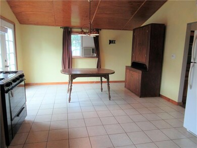 Large open dining area with a french door leading 