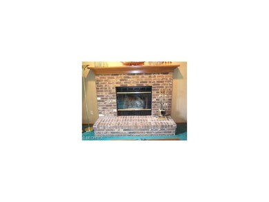 Brick Fireplace with Wood Mantel in Family Room!