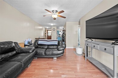 Living Room facing Dining Area, Kitchen and Entry