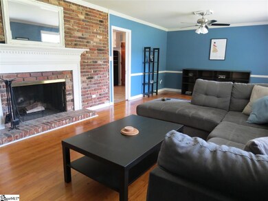 Notice the lovely fireplace and real hardwoods. Ve