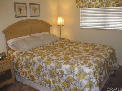 One of the bright second bedrooms with ceiling fan