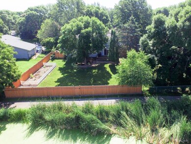 Beautiful fenced backyard has gate to trail system