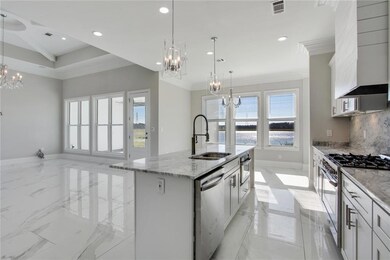 Multiple counter tops, island includes dishwasher
