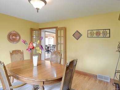 Formal dining room with French doors that open and