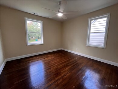 featuring ceiling fan, refinished dark wood floori