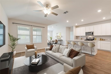 Living room with light wood-style floors, a ceili