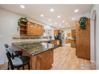 Good flow in this kitchen with large granite countertops