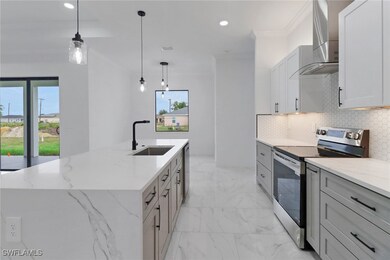 Kitchen with stainless steel range with electric s