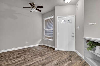 Welcome home.  Floors are wood look tile.