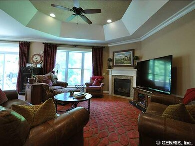 Great Room. Large windows allow a view of the wood