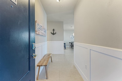 Step inside to a cheerful coastal welcome—this ent