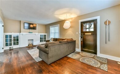 Decorative fireplace with built in book cases.