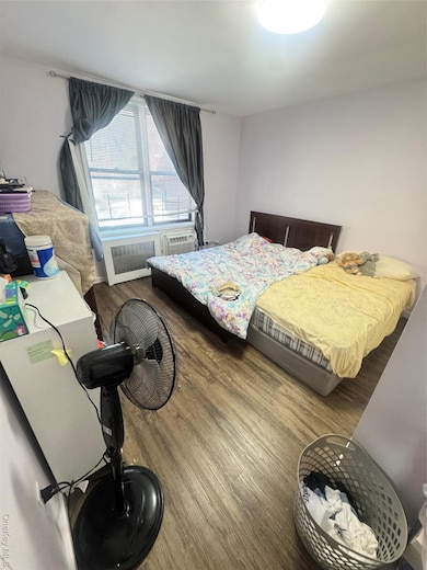 Bedroom featuring wood finished floors