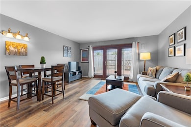 living/dining room with brand new flooring - doors