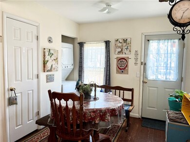 Bright dining area with door to back yard.