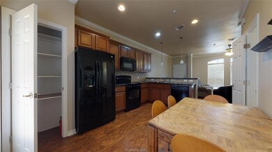 Kitchen featuring visible vents, ornamental moldin