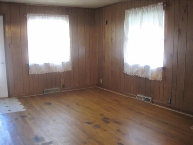 Living room with bright windows.