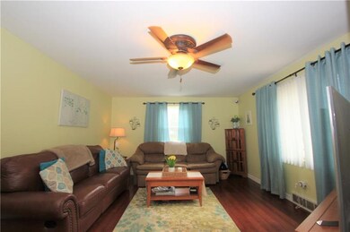 The oversized living room has two very large windo