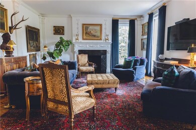 Living room featuring a fireplace and ornamental m