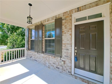 Doorway to property with covered porch