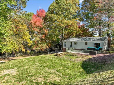 Large fenced in backyard with a great deck for ent
