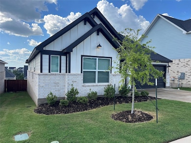 View of front of home with board and batten sidin