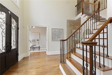 Graceful staircase with wrought iron balusters and