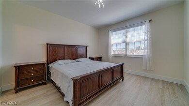Bedroom with light hardwood / wood-style floors