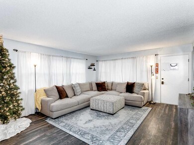 Large 18 x 15 living room with lots of natural lig