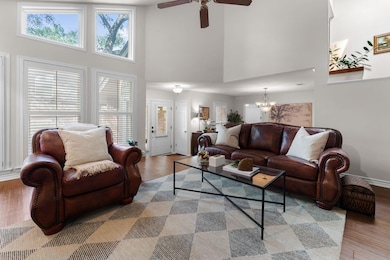 Living room featuring a high ceiling, healthy amo