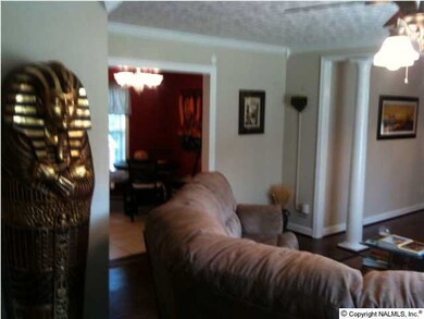 Wide-cased opening leads into the breakfast area. Great room is spacious! Great for entertaining or family relaxation.