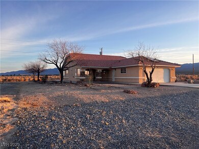 View of front facade with an attached garage, a mo