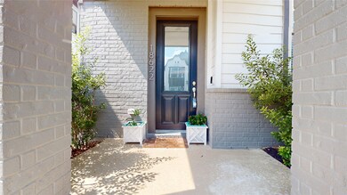 Inviting front entrance with a charming patio.