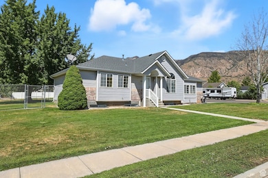 View of front of house with roof with shingles and a mountain view