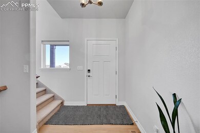Entrance foyer featuring a notable chandelier and 
