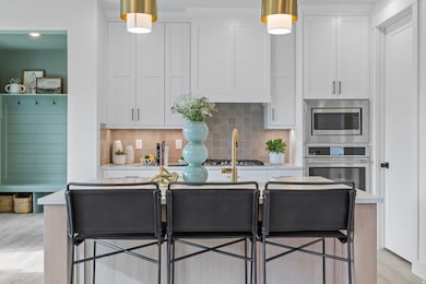 LARGE ISLAND BAR! (PICTURE OF PREVIOUS BUILT HOME-COLORS AND MATERIALS MAY VARY)