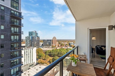 Private balcony with unobstructed cityscape views. Ideal for morning coffee or evening unwind time.