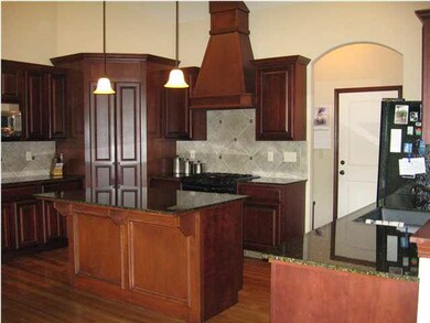 Kitchen with Walk-in Pantry, lots of Cabinets and 