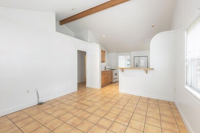 Unfurnished living room with light tile patterned