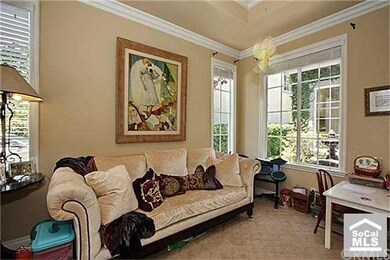 Formal living room  featuring  abundant natural li