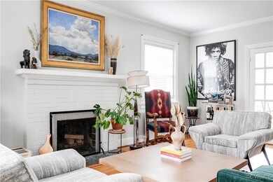 The fireplace is adorned with a substantial white