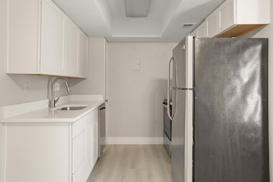 Kitchen featuring stainless steel appliances, lig