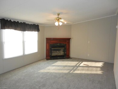 Den w/ Wood Burning Fireplace
