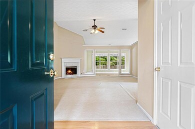 Foyer with a fireplace, a textured ceiling, a ceil