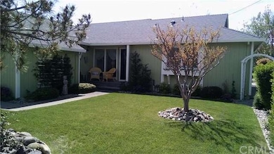 Manicured lawn with walkway to front door
