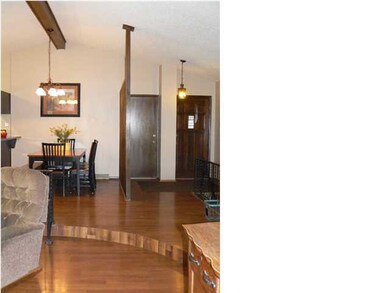 View of the front door/foyer/dining area, as seen 
