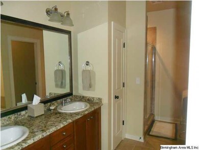 Master bath with garden tub opposite vanity and se