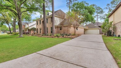 Long driveway leading to two-car detached garage